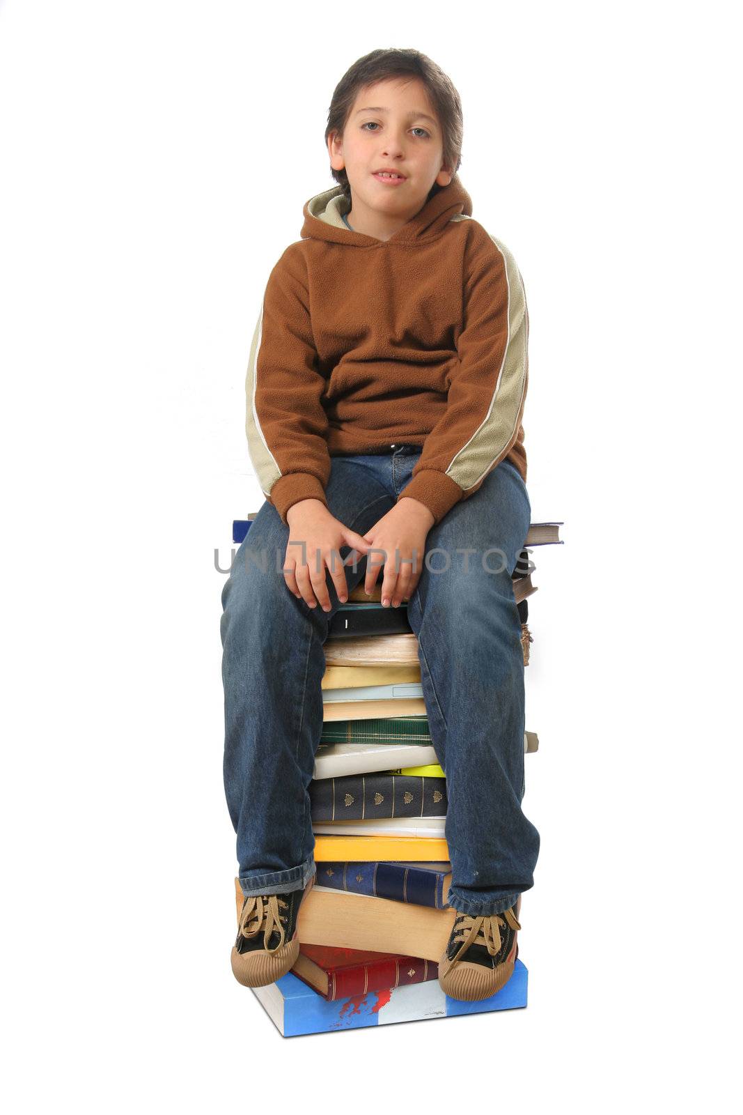 Boy sitting on a big pile of books. Different expressions (series)  