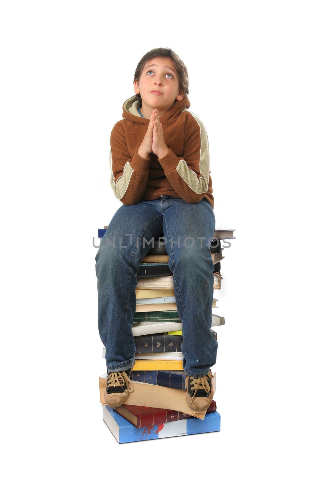 Boy sitting on a big pile of books. Different expressions (series)  