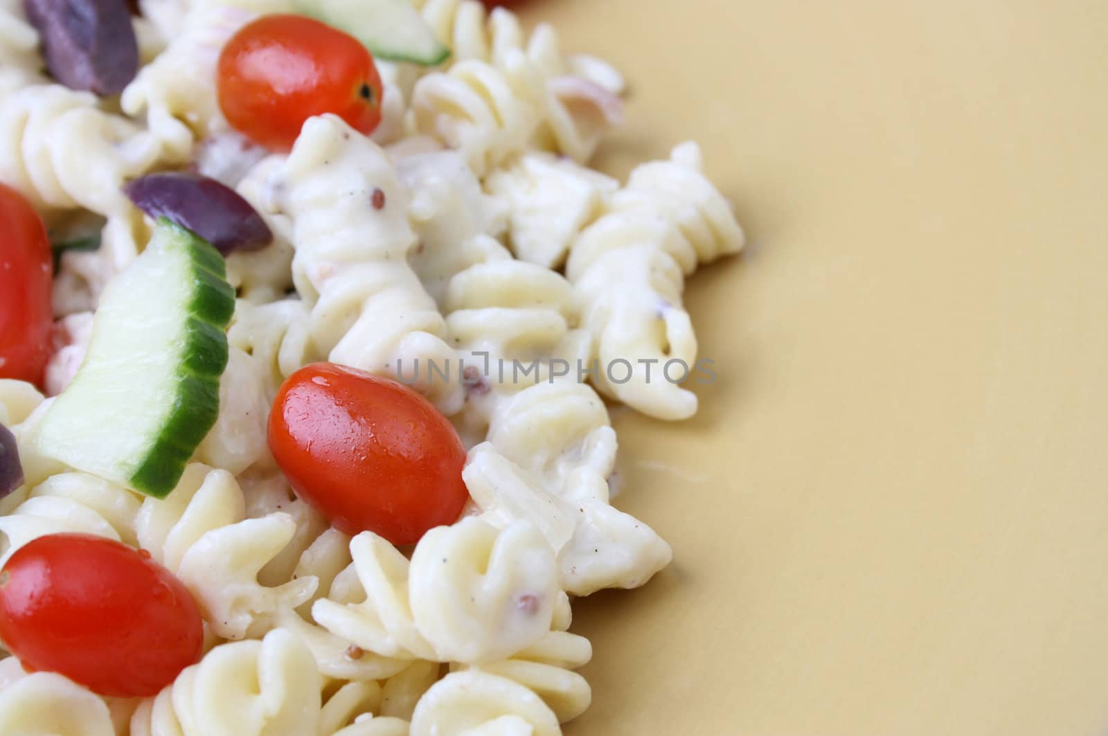 Cold Pasta Salad with tomatoes, cucumbers and olives