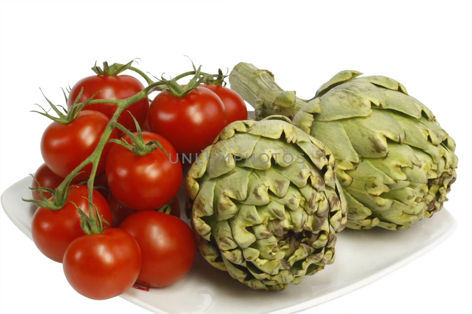 Fresh artichokes and tomatoes - isolated on white background