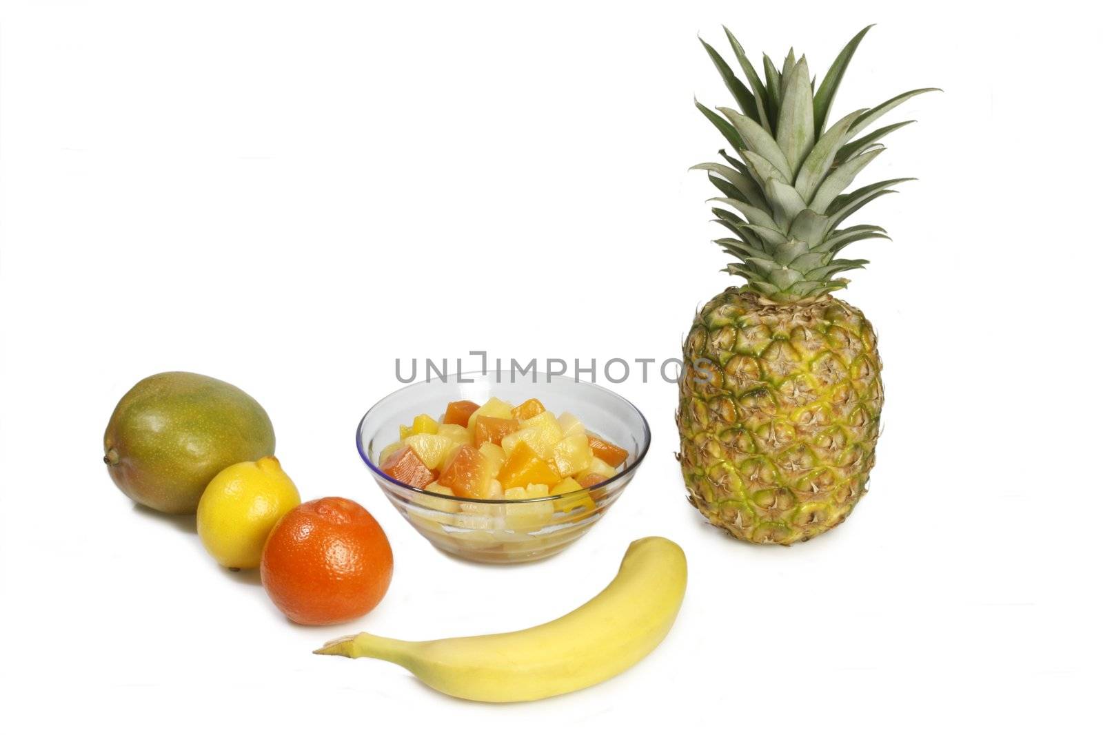 Fruit salad with different tropical fruits - isolated on white background