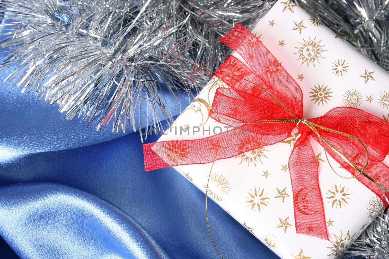 Wrapped christmas gifts with tinsel and bow
