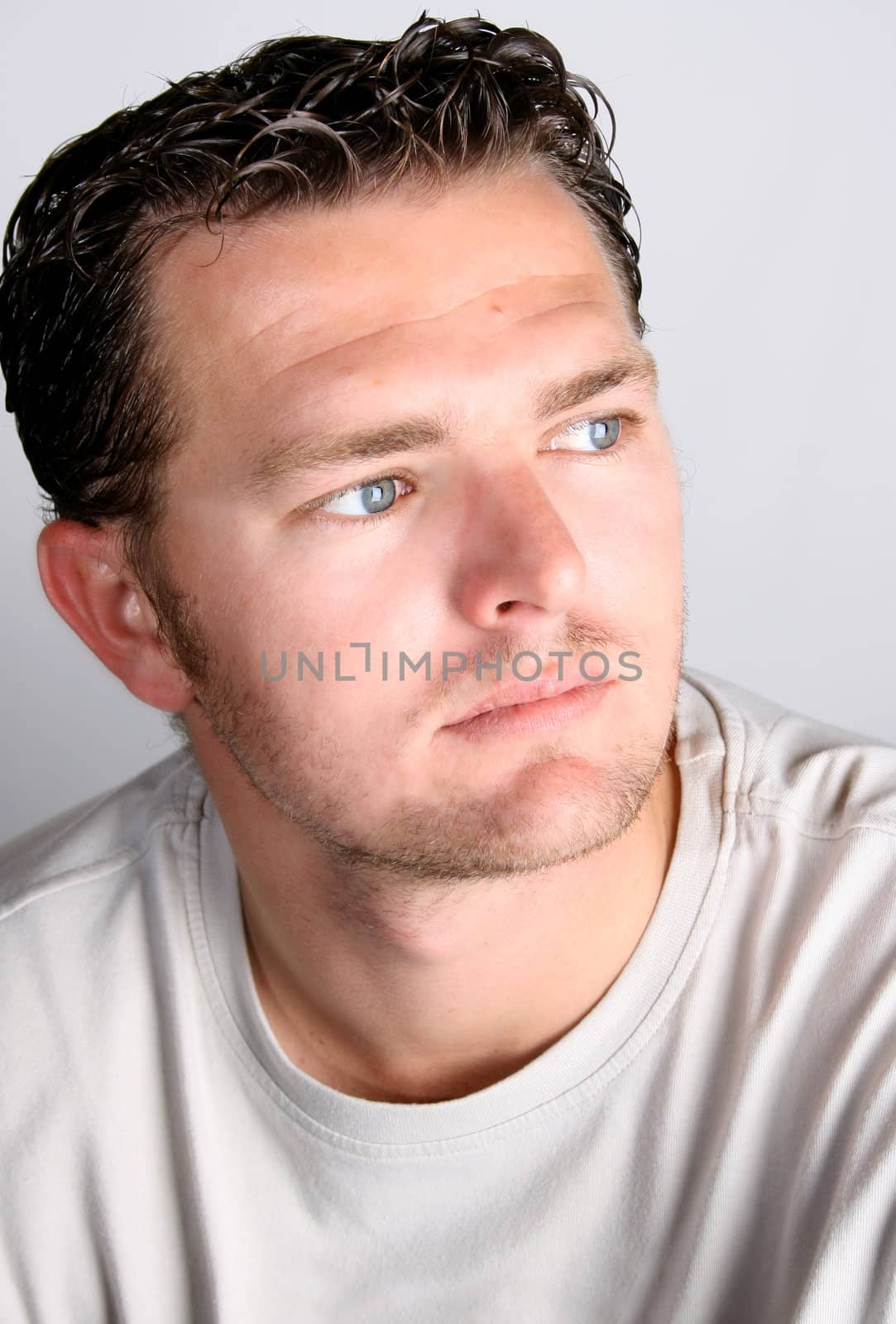 Casual male against a light studio background