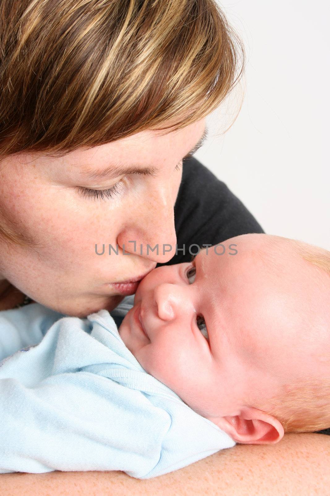 Loving mother holding her new baby boy