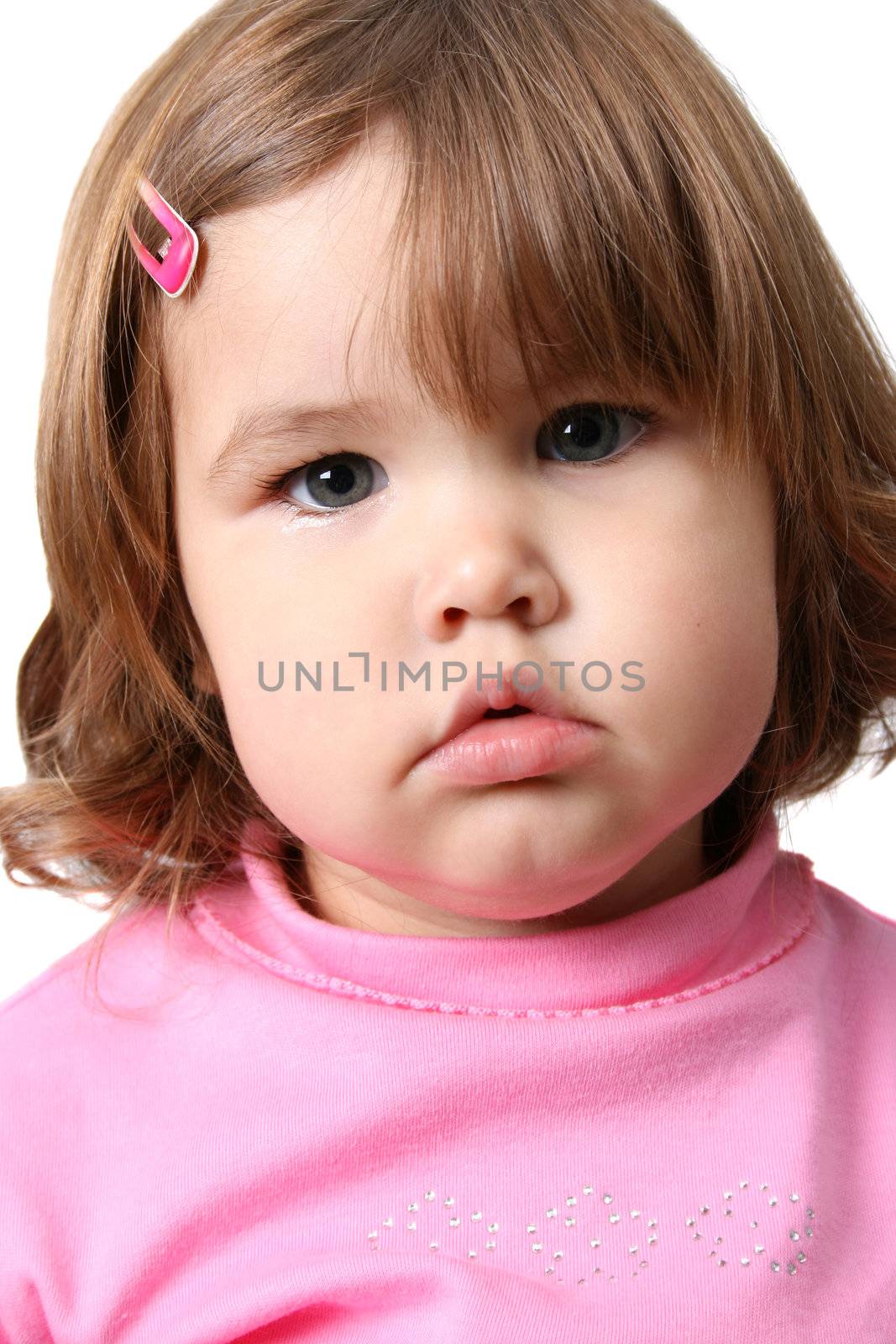 Beautiful brunette toddler wearing a pink top