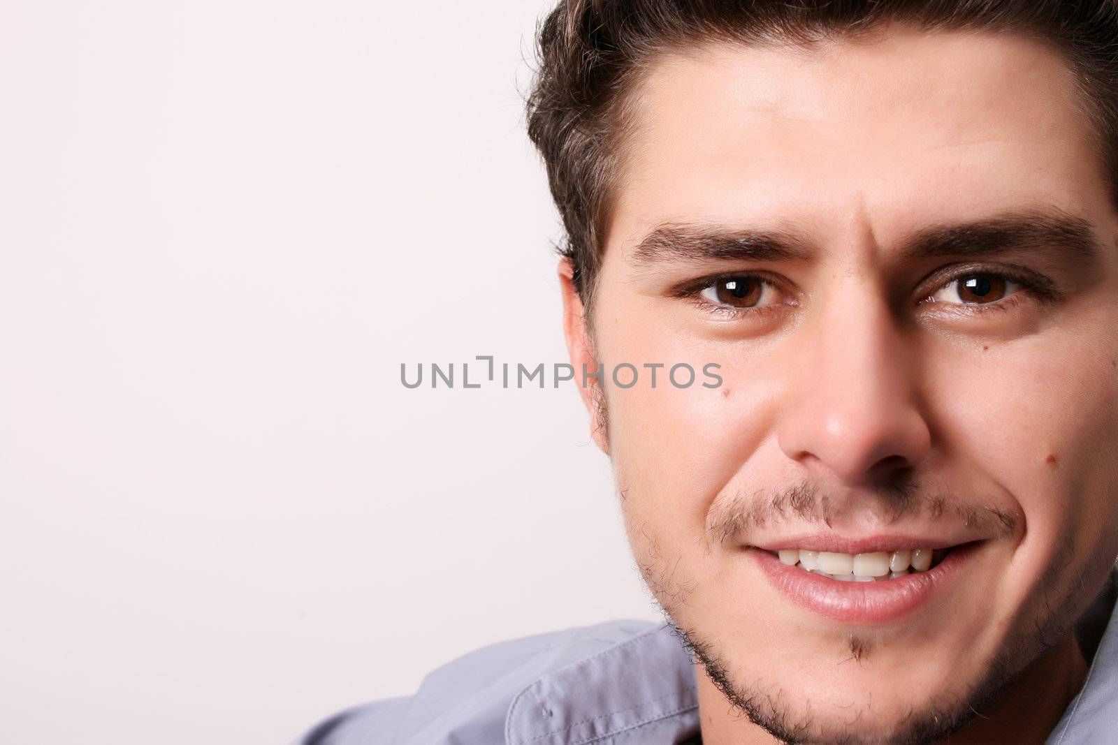 Male model in studio against white wall