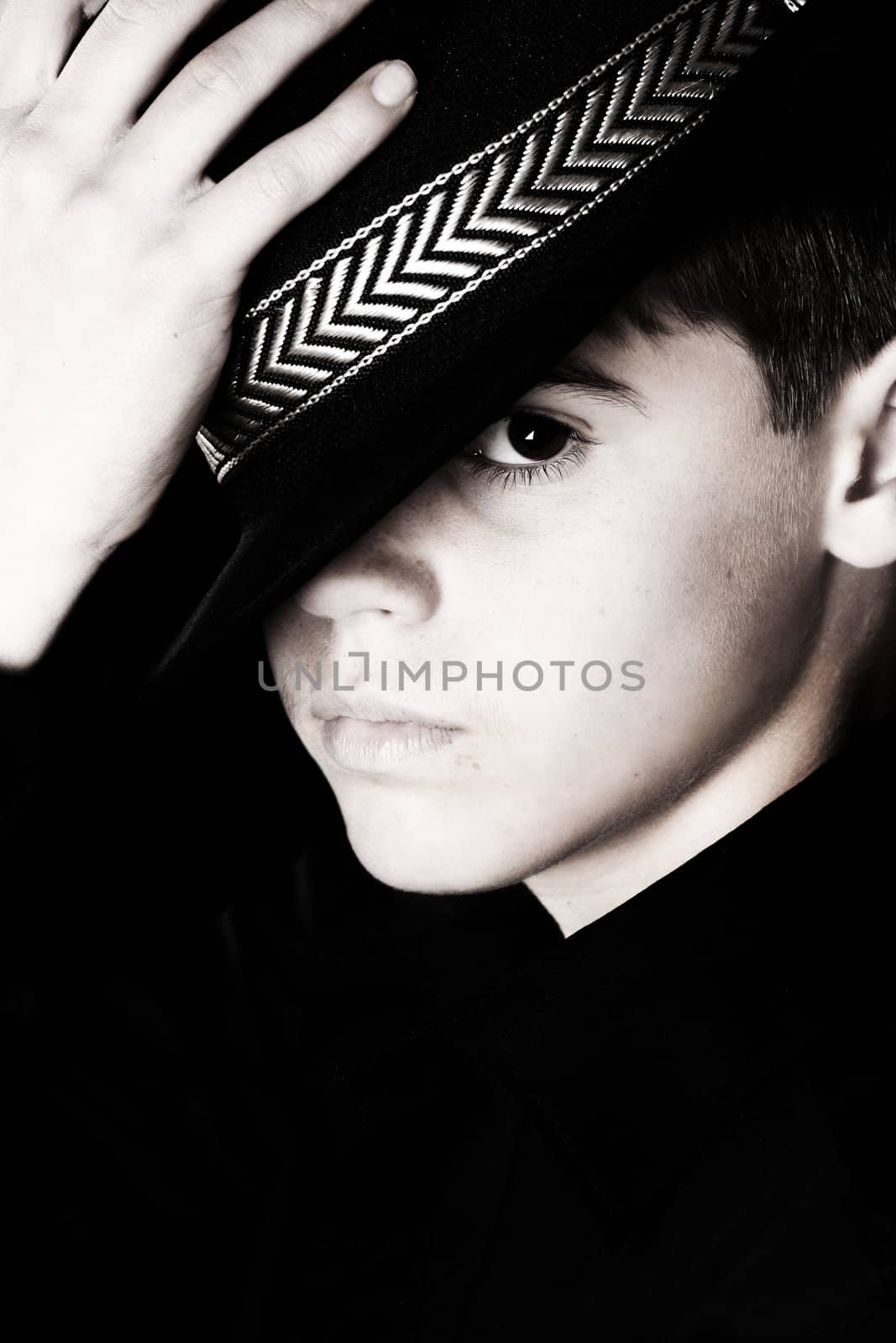 Teenage boy wearing a black hat in casual wear