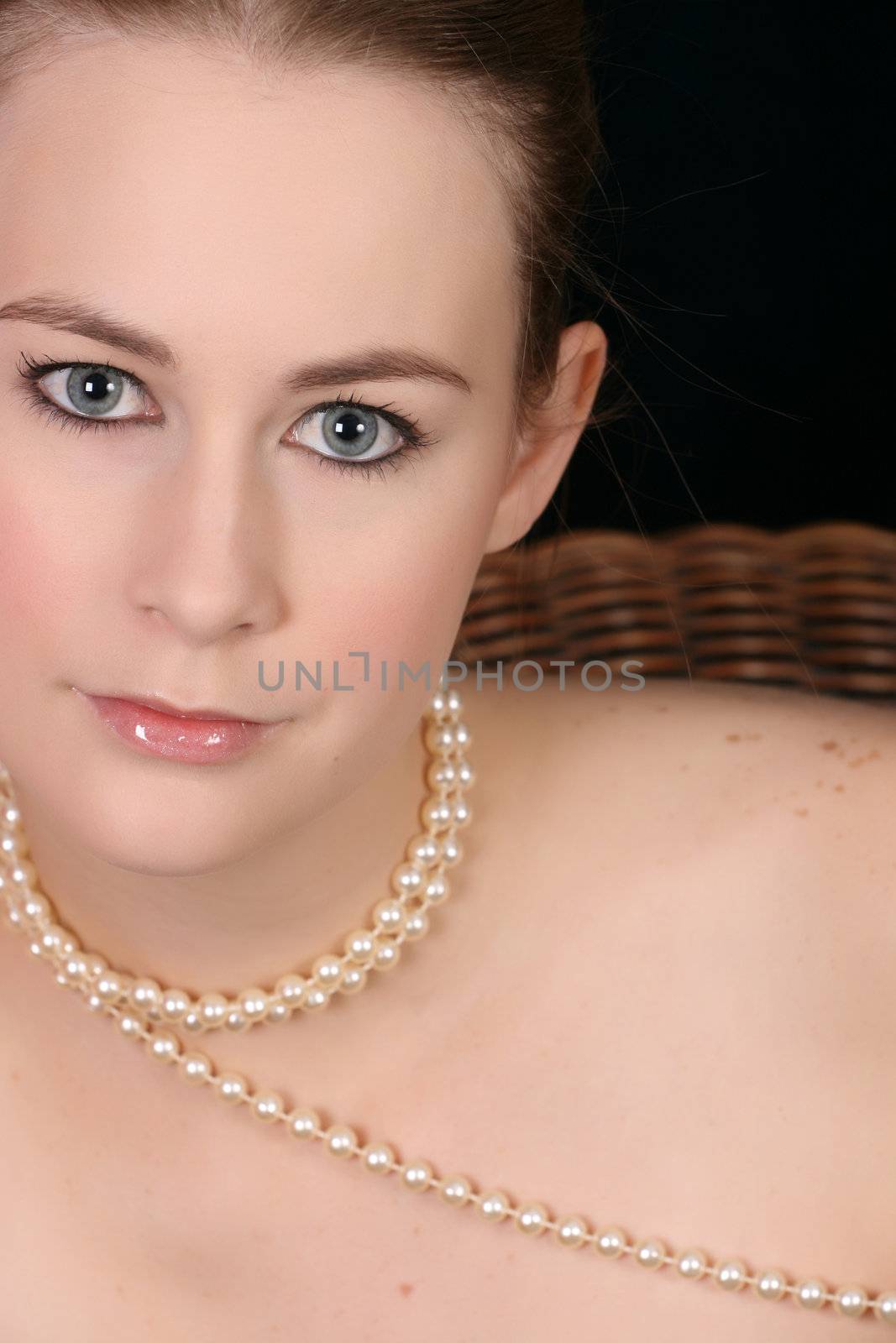 Close up of beautiful female wearing pearls 