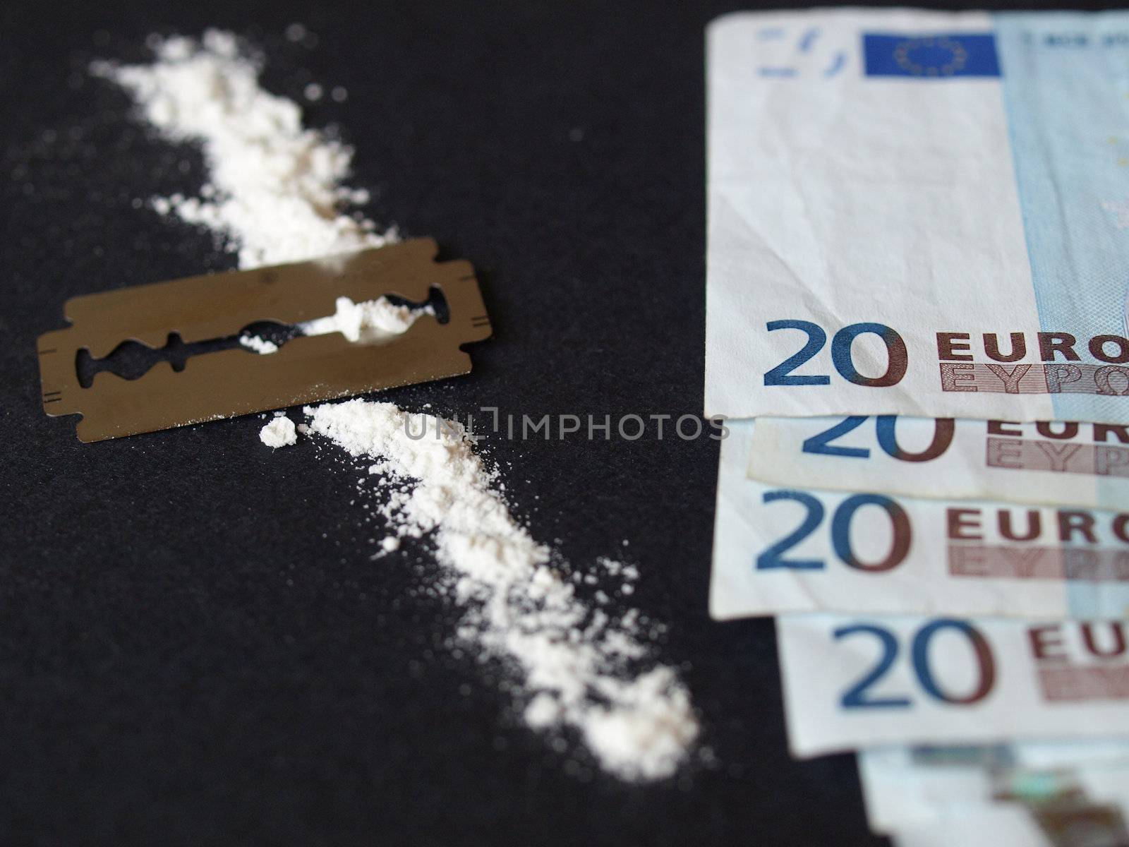 Cocaine, razor blade and money (simulation using wheat flour, no actual drugs used)