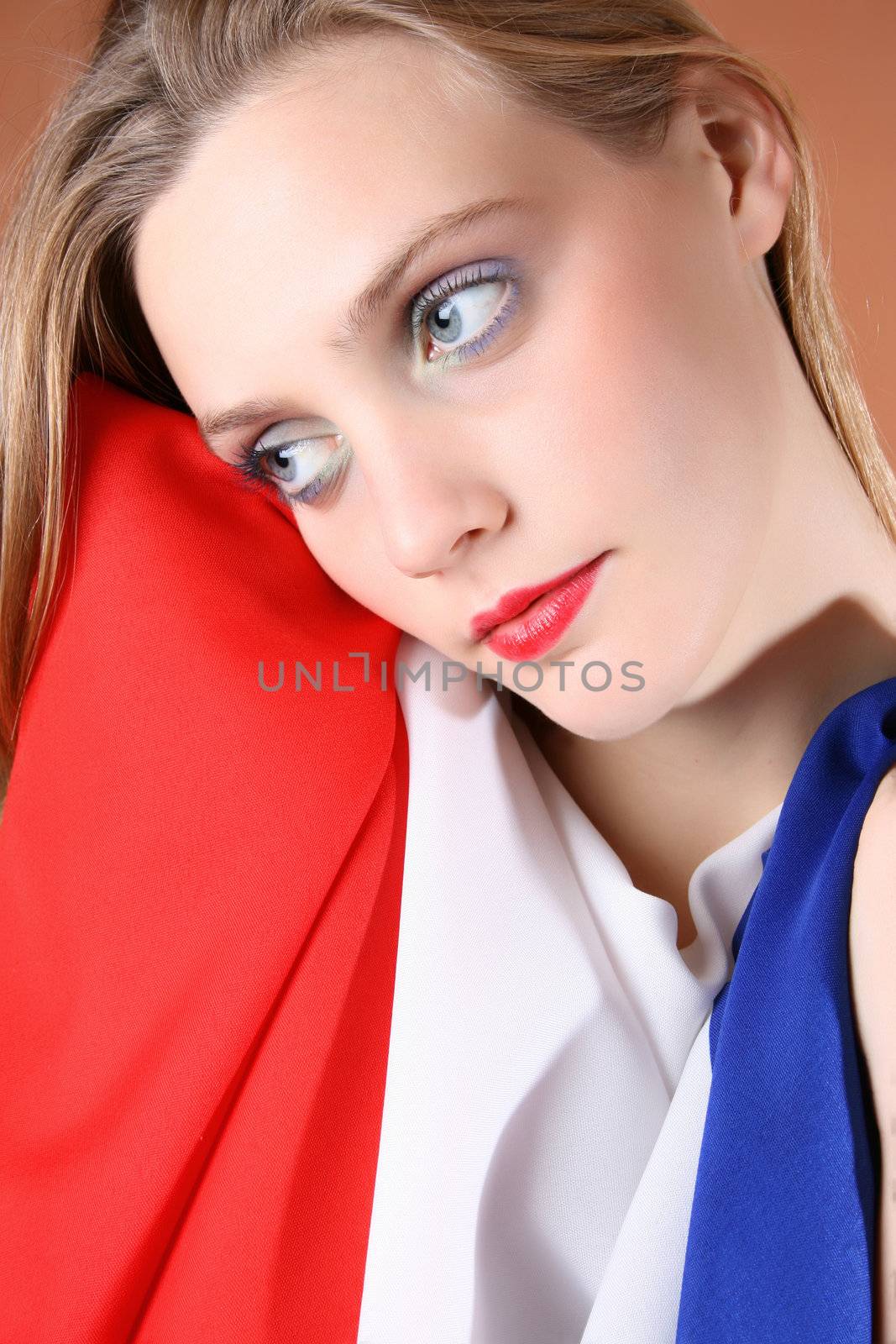 Beautiful young female covered by a French Flag