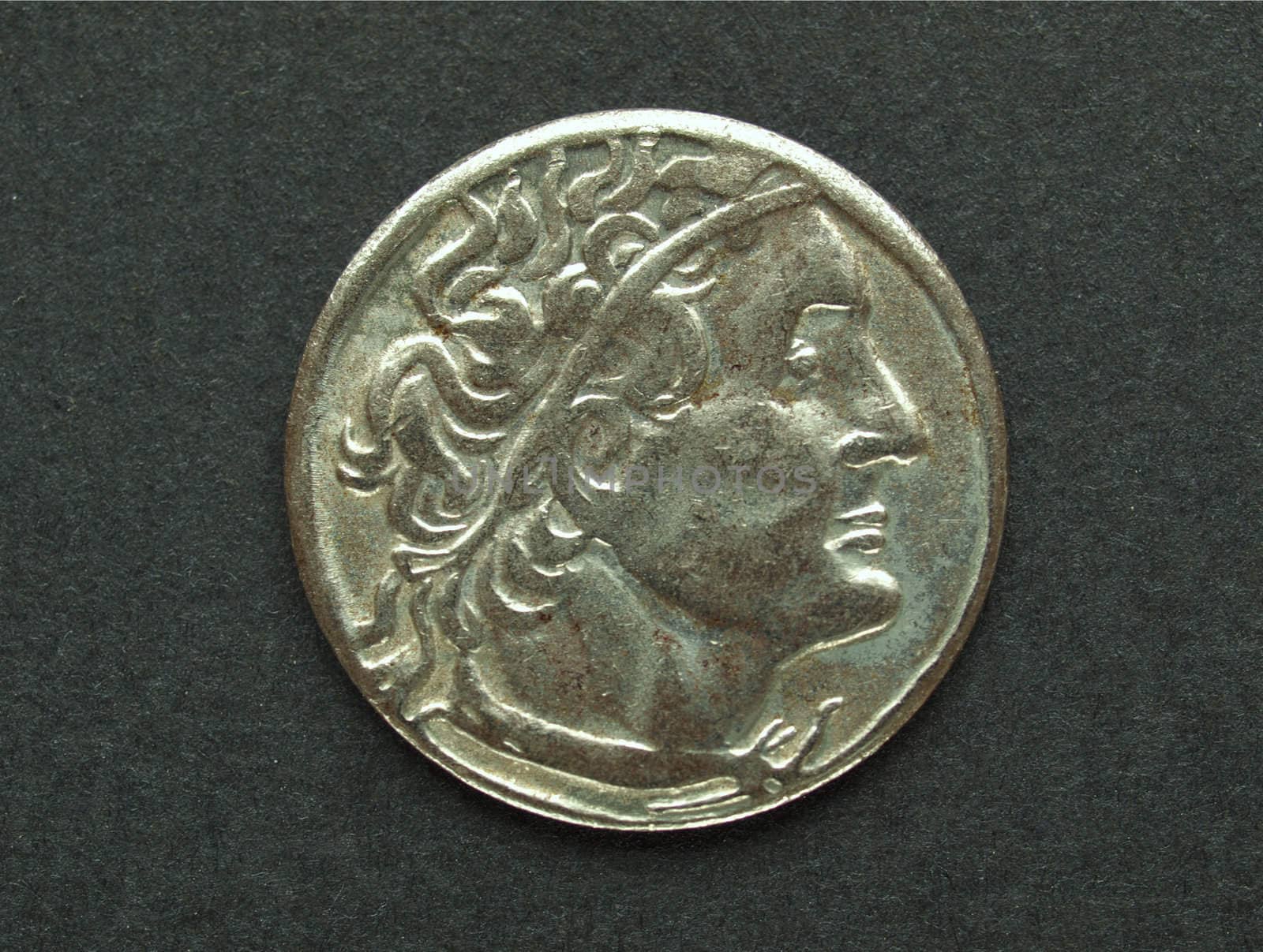 Ancient Roman coin on a black background