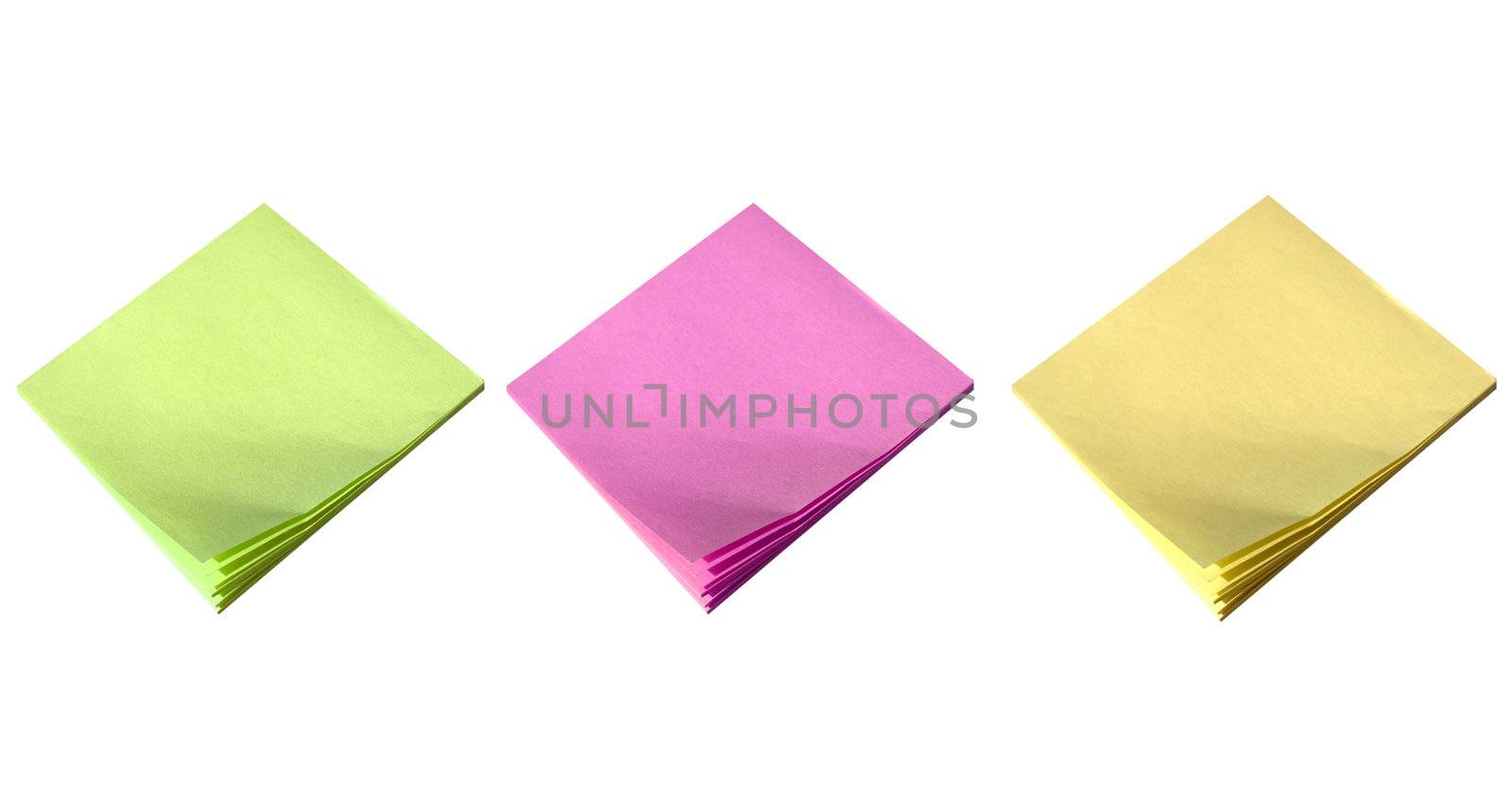 Yellow green and pink postit isolated over a white background