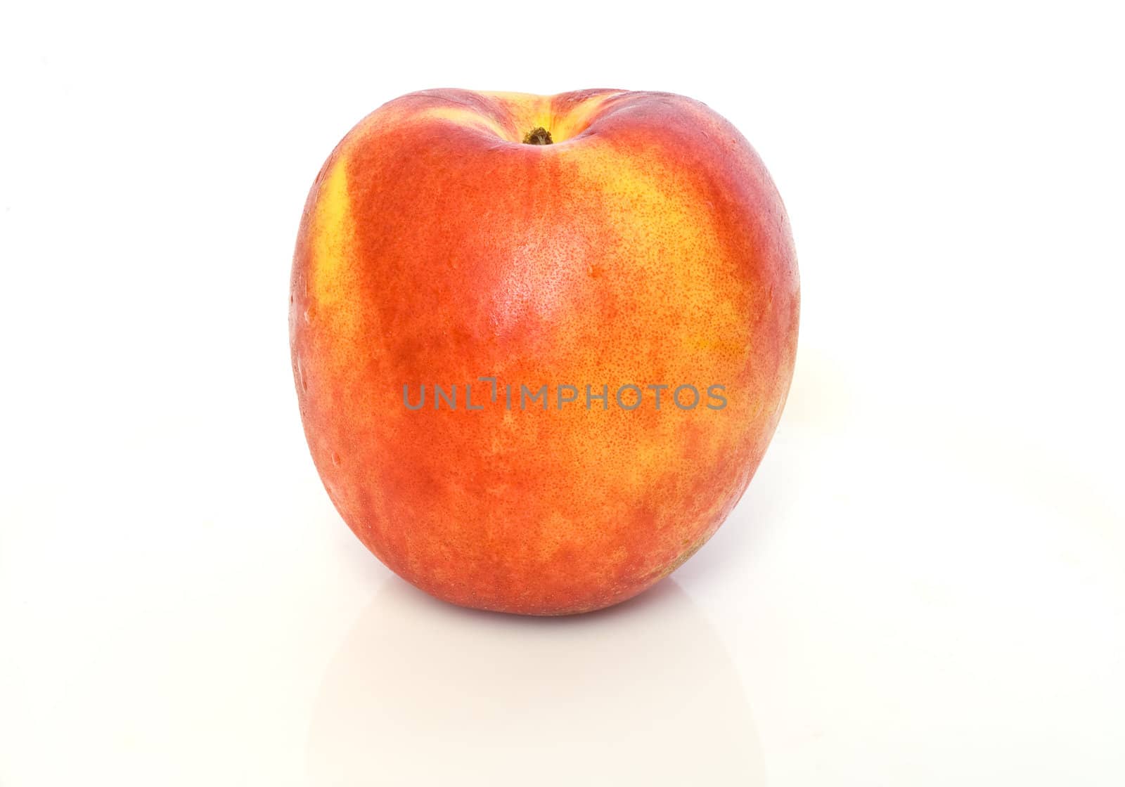Fresh ripe nectarine isolated on white background