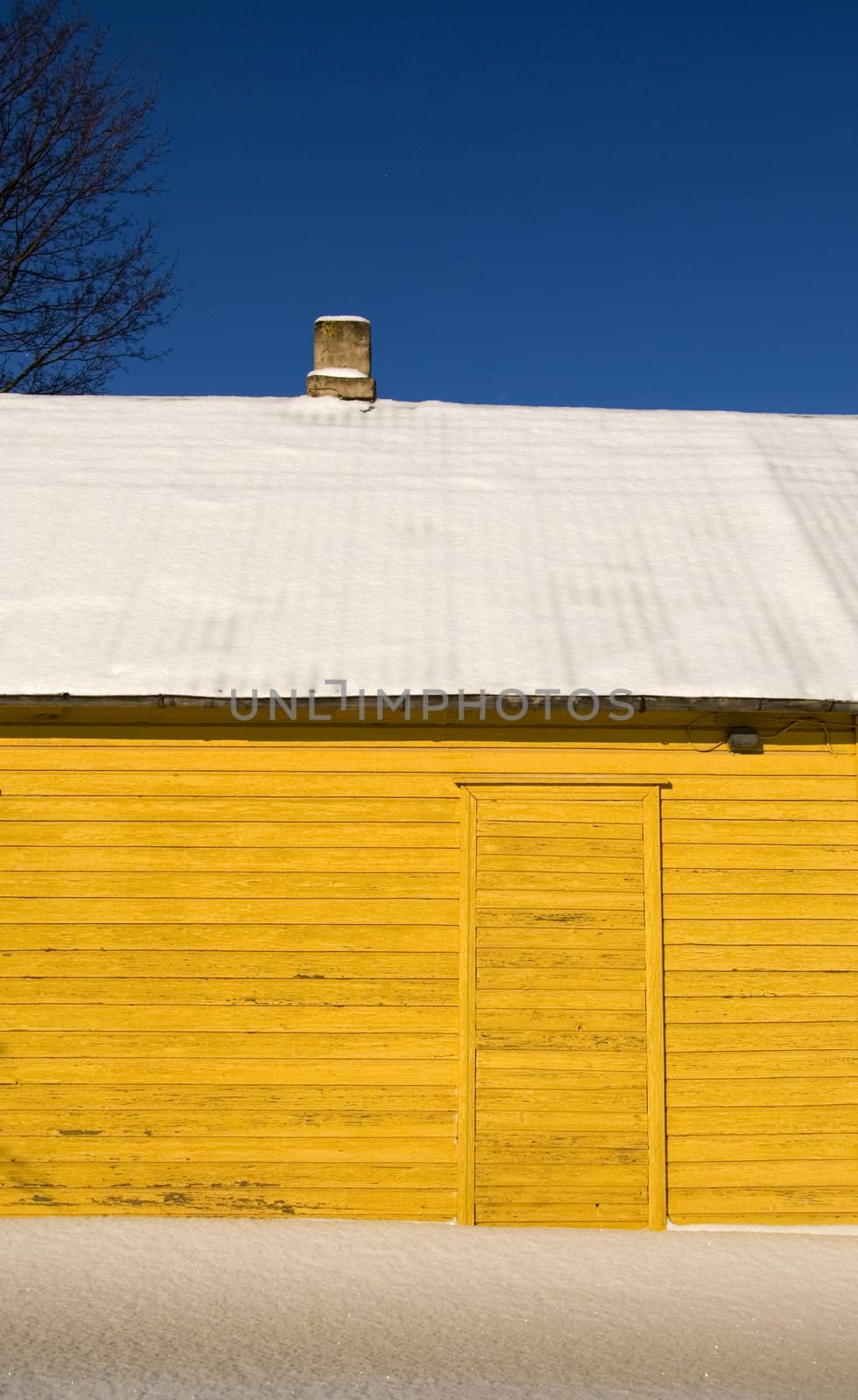 yellow winter house fragment and snow