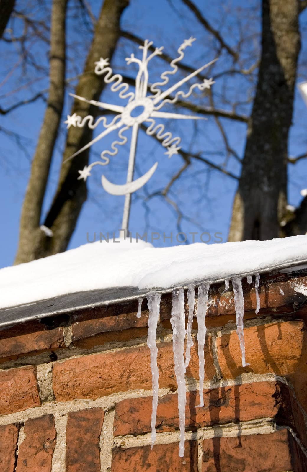 winter icicle on red brick wall