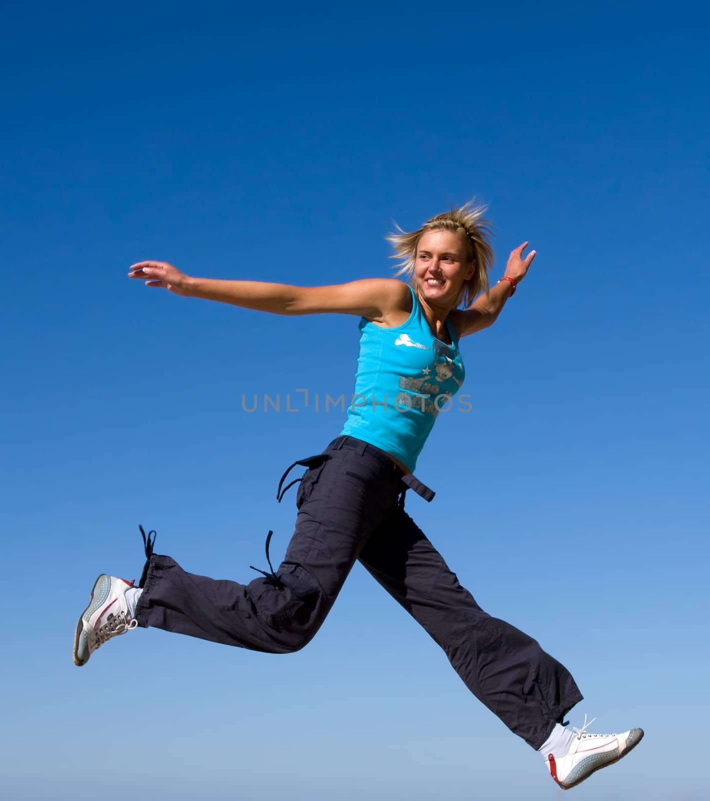 jumping girl blue sky high