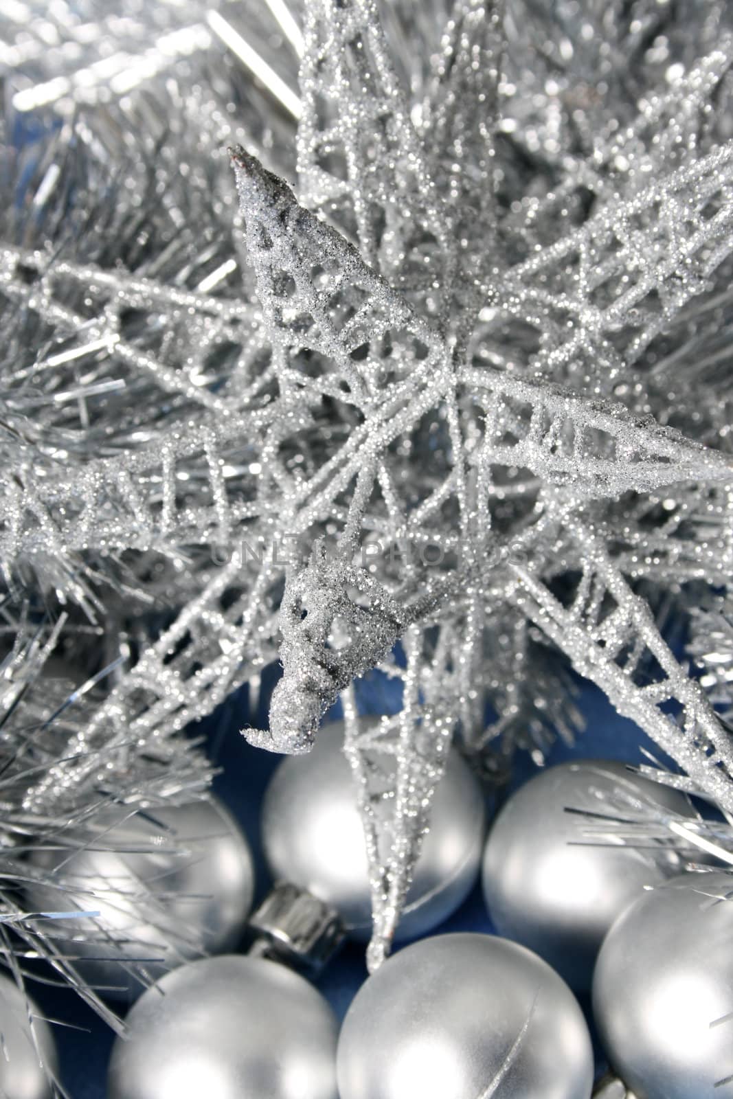 Silver Christmas star decoration, balls and tinsel