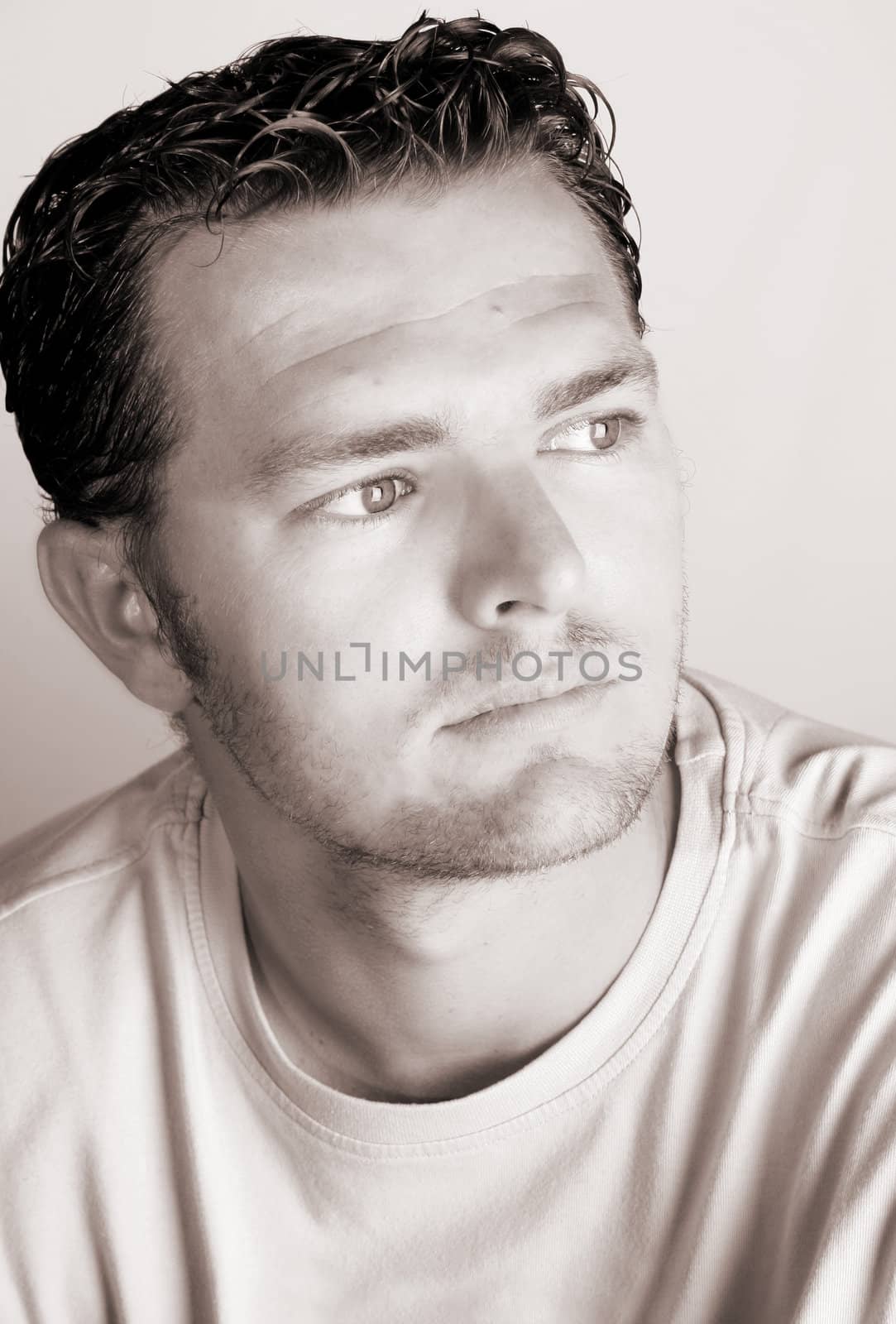 Casual male against a light studio background