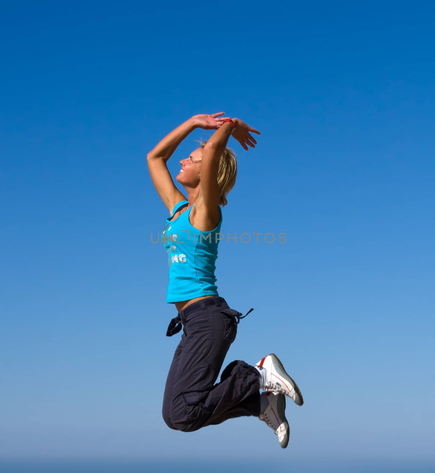 jumping girl blue sky high