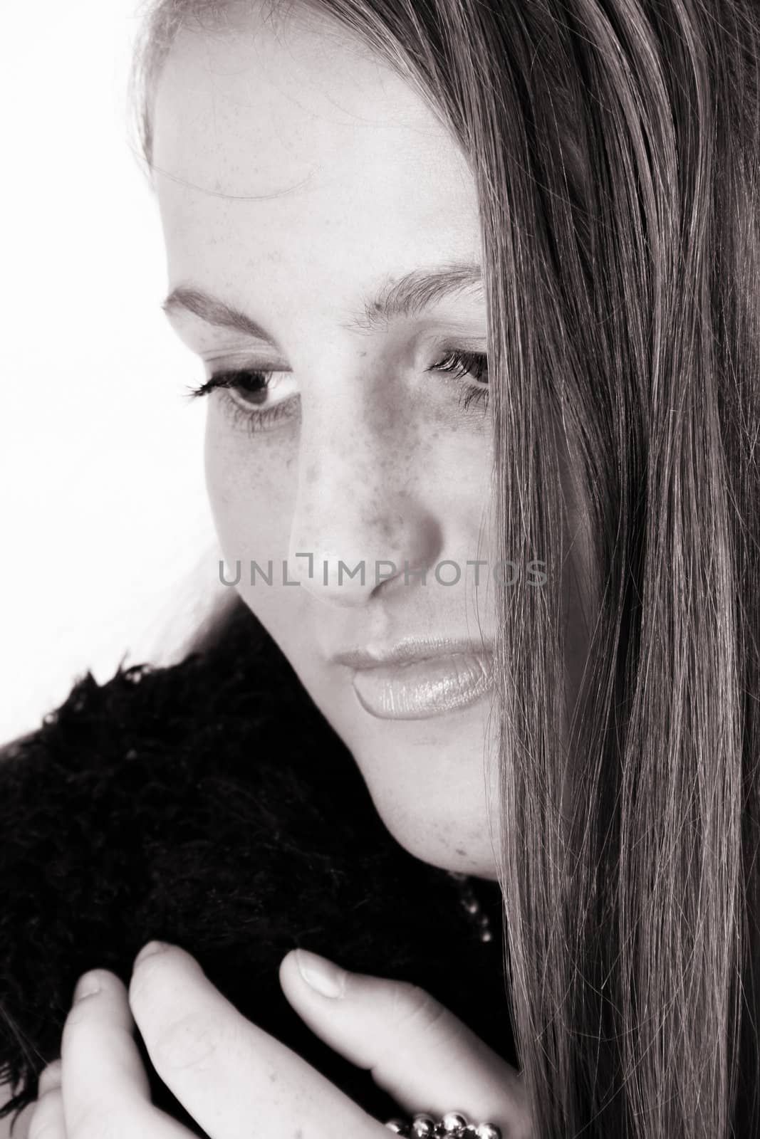 Close up of female teenager against a white background