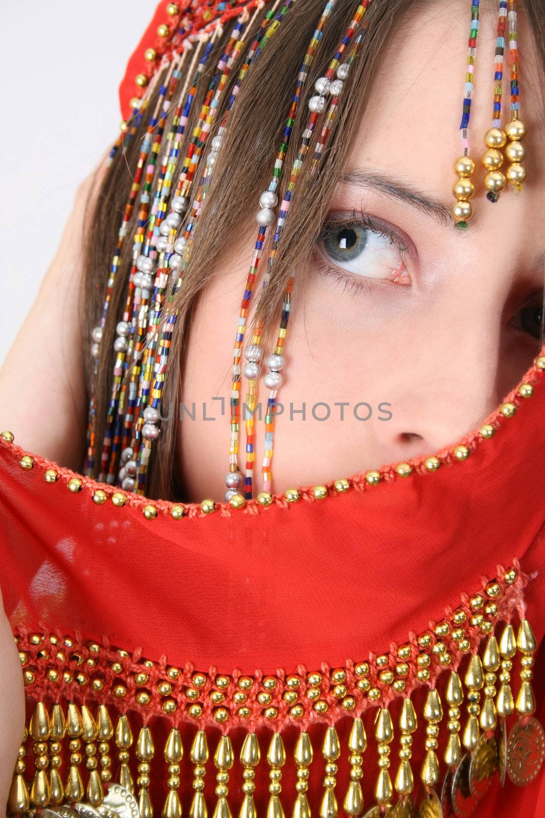 Beautiful young teenager posing in a belly dance costume
