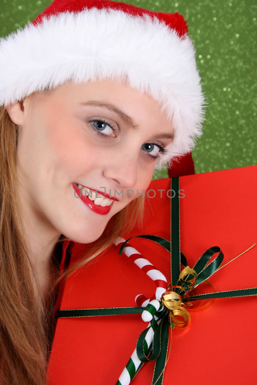 Teenager with red lips wearing a christmas hat