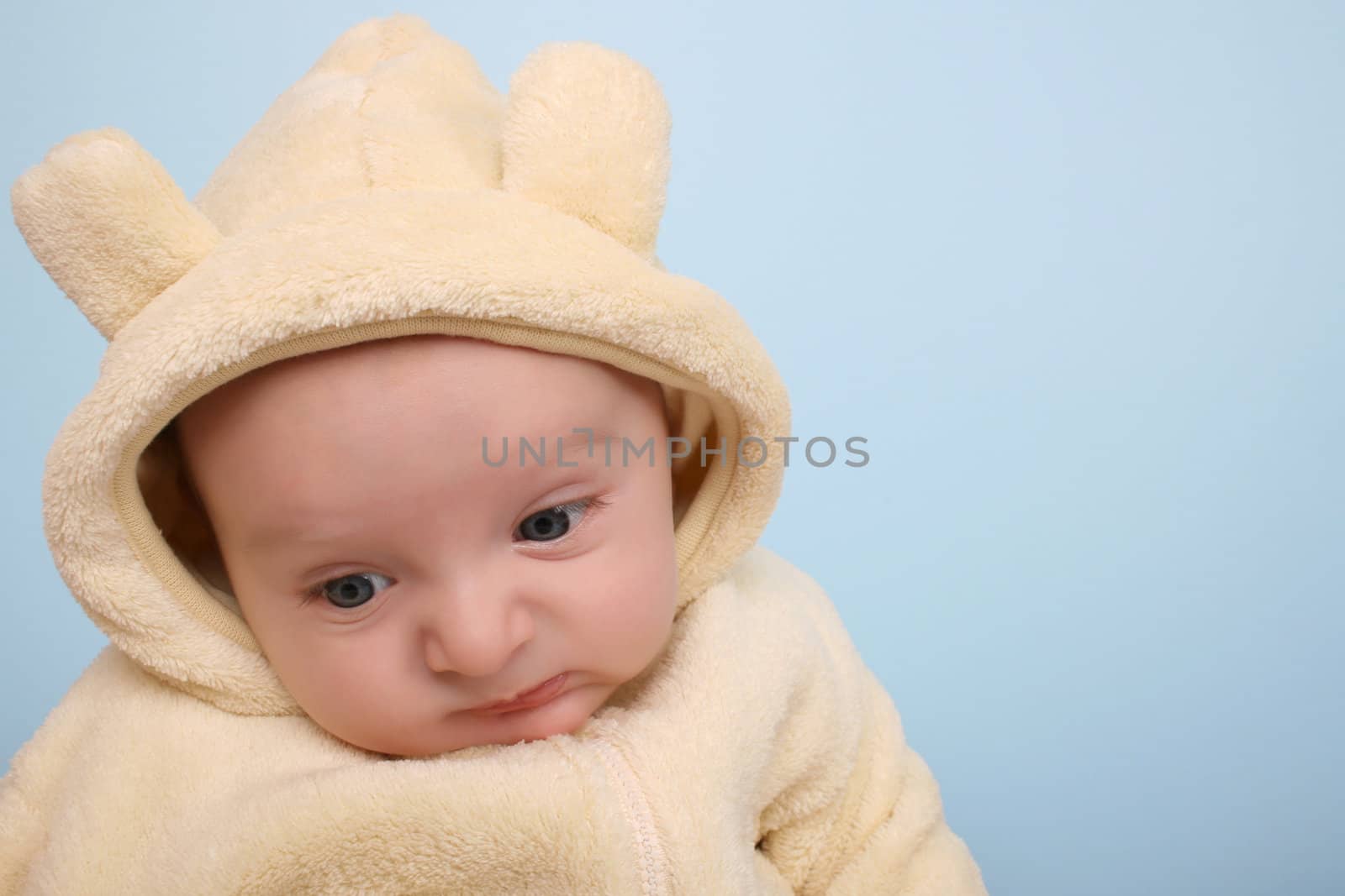 Two month old baby boy wearing a soft animal suit