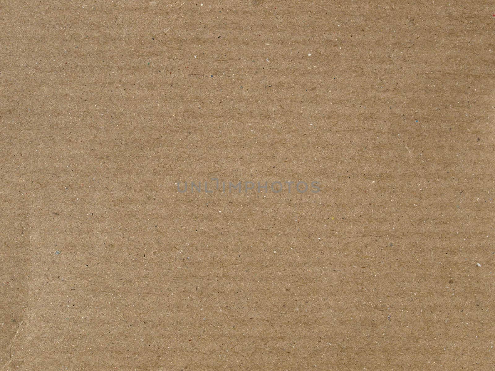 Brown corrugated cardboard sheet useful as a background
