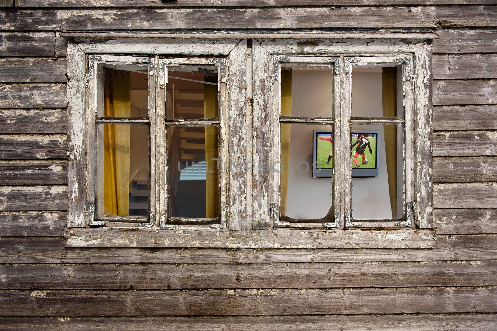 House needs maintenance while owner relax in front of the television