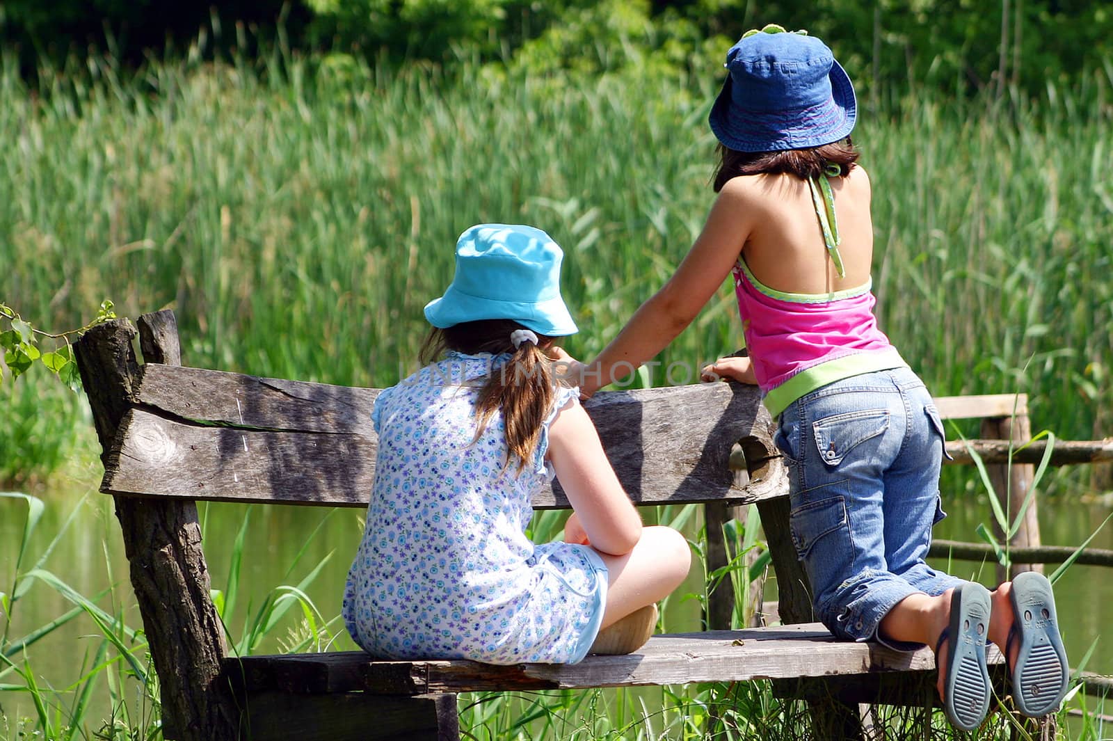 two girl at the bench