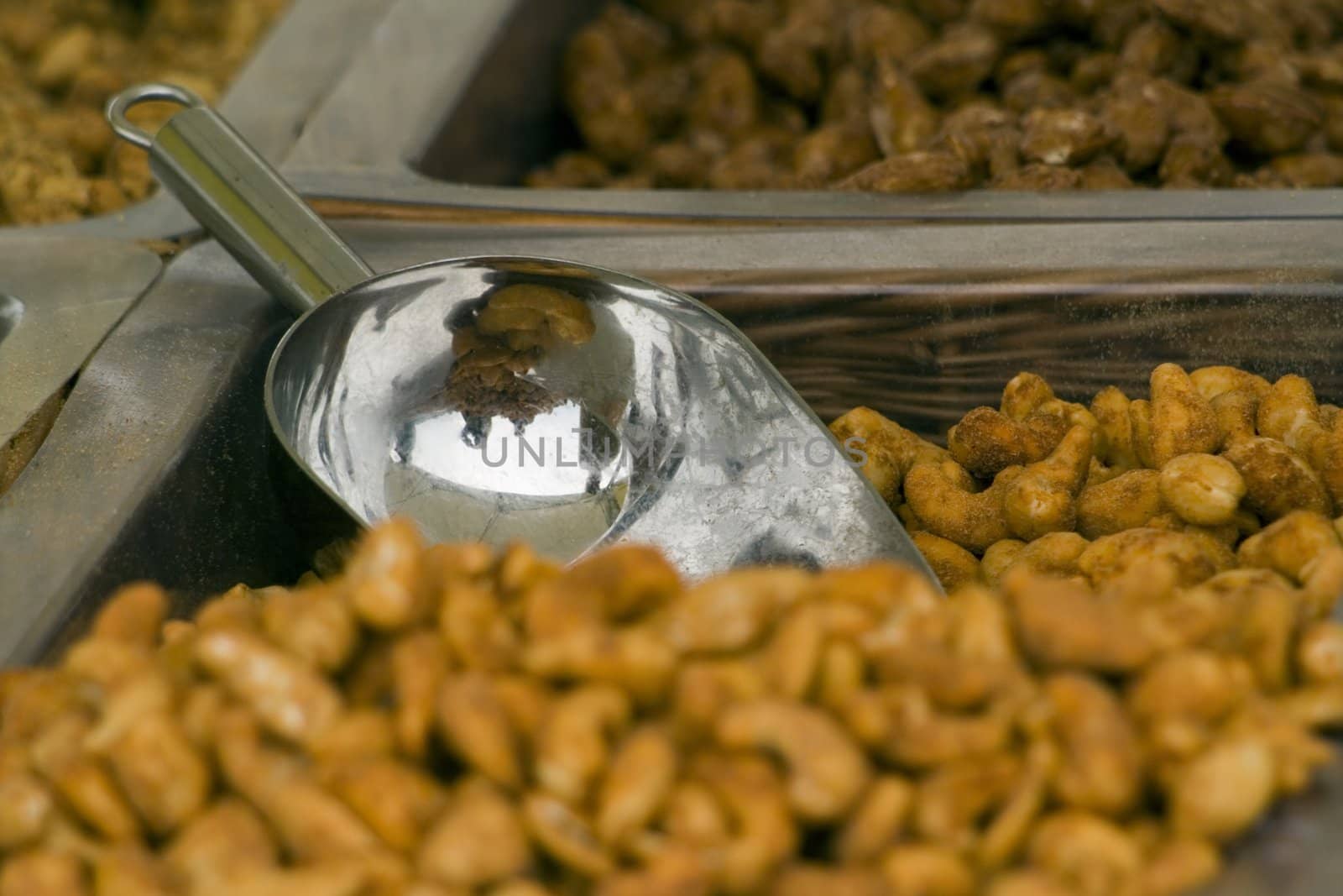 a basket of dry roasted peanuts with a scoop