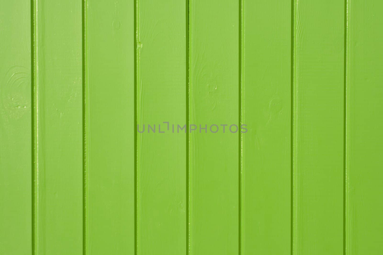 A green painted wooden panel background