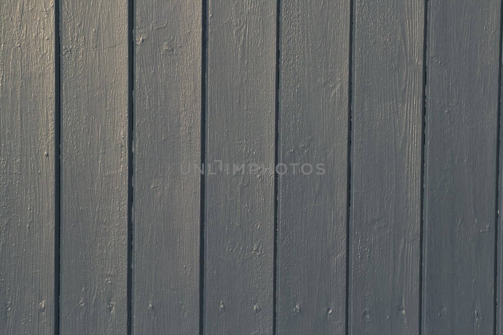 A painted wooden panel background, made up of 7 slats