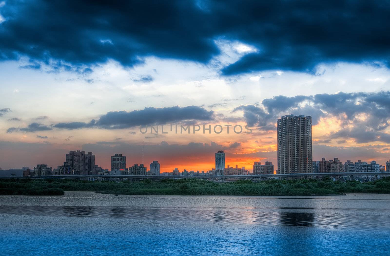 Here is city night scene with the river in Taiwan.