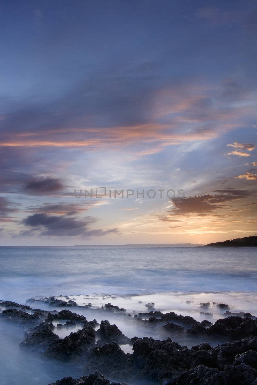 It is sunset of beautiful coral reef coastline.