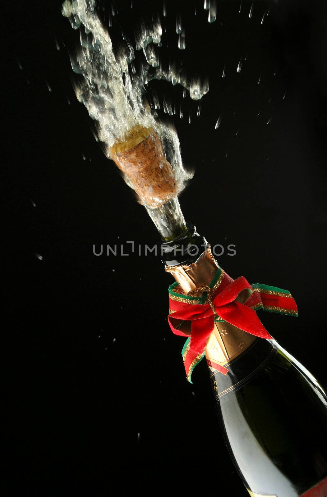 Champagne splash. Bottle and cork, with christmas decoration