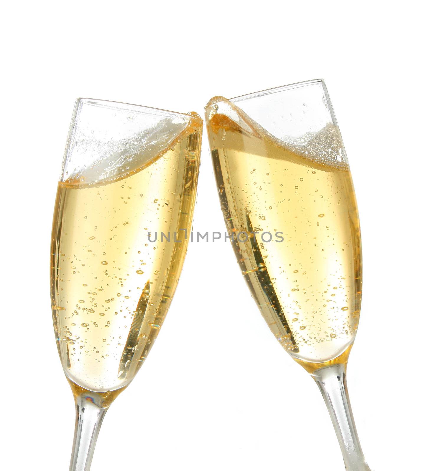 Pair of champagne flutes making a toast. Champagne splash