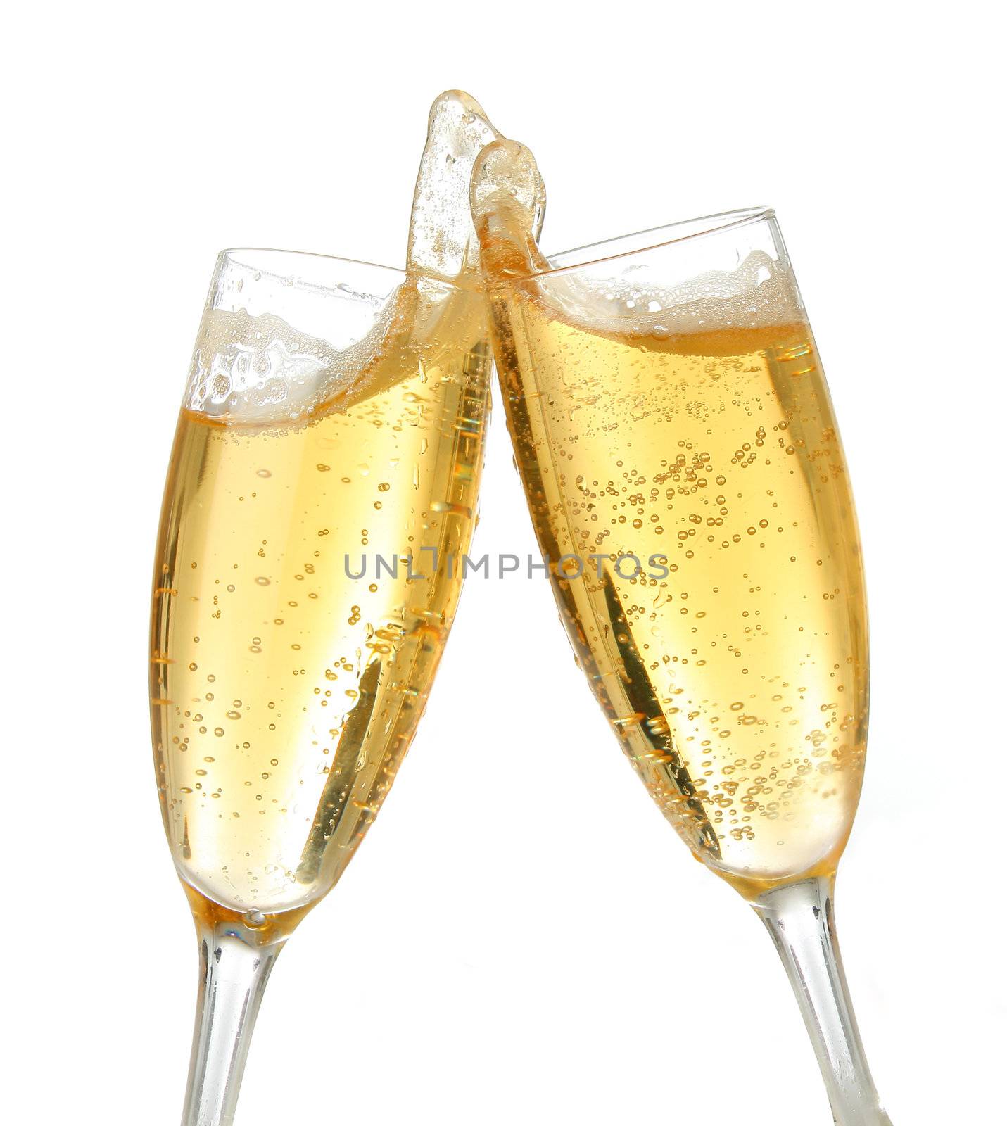 Pair of champagne flutes making a toast. Champagne splash