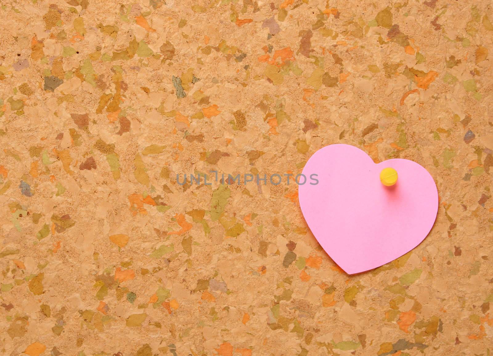 Cork board with heart shape sticky note