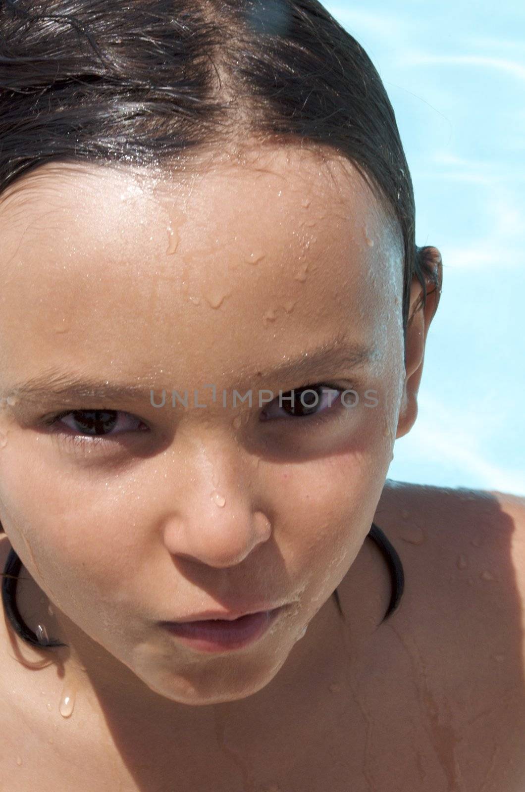 Little boy having fun at neighborhood pool by jedphoto