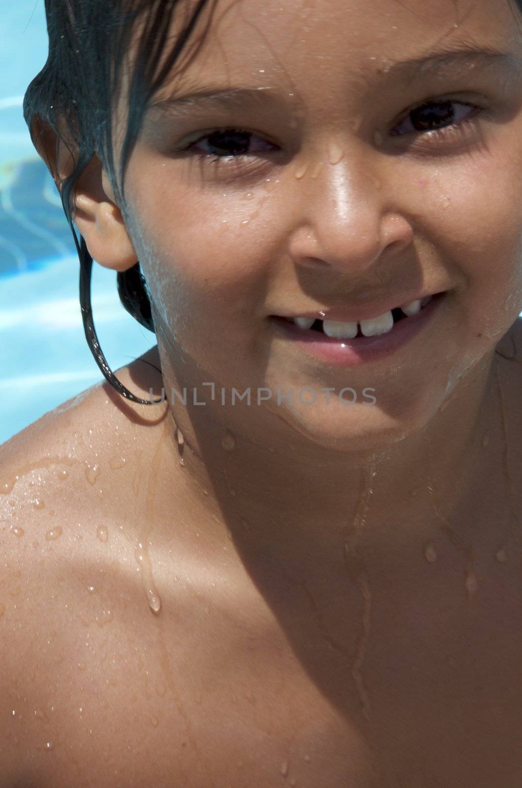 Little boy playing at pool