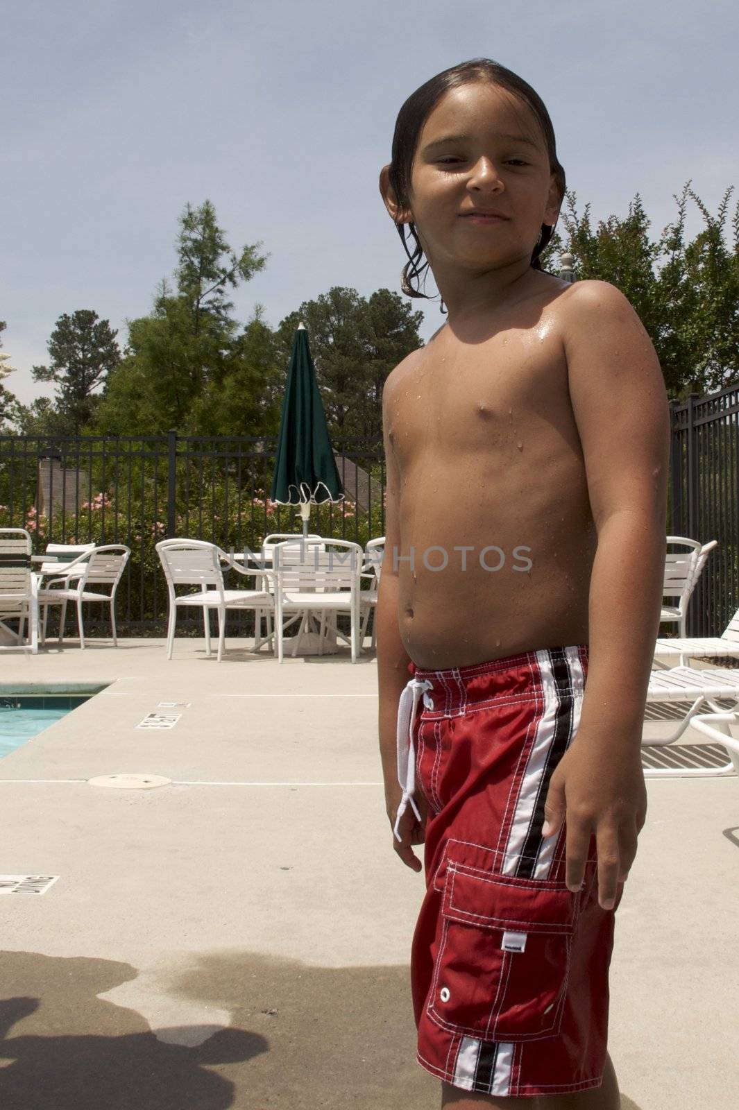 Little boy playing at pool