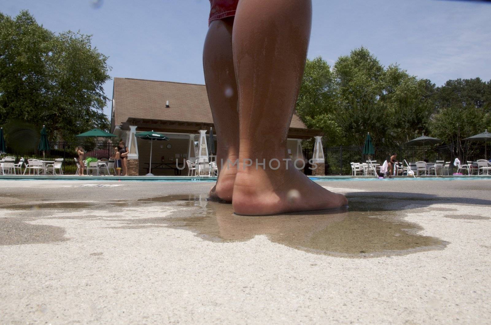 Little boy playing at pool