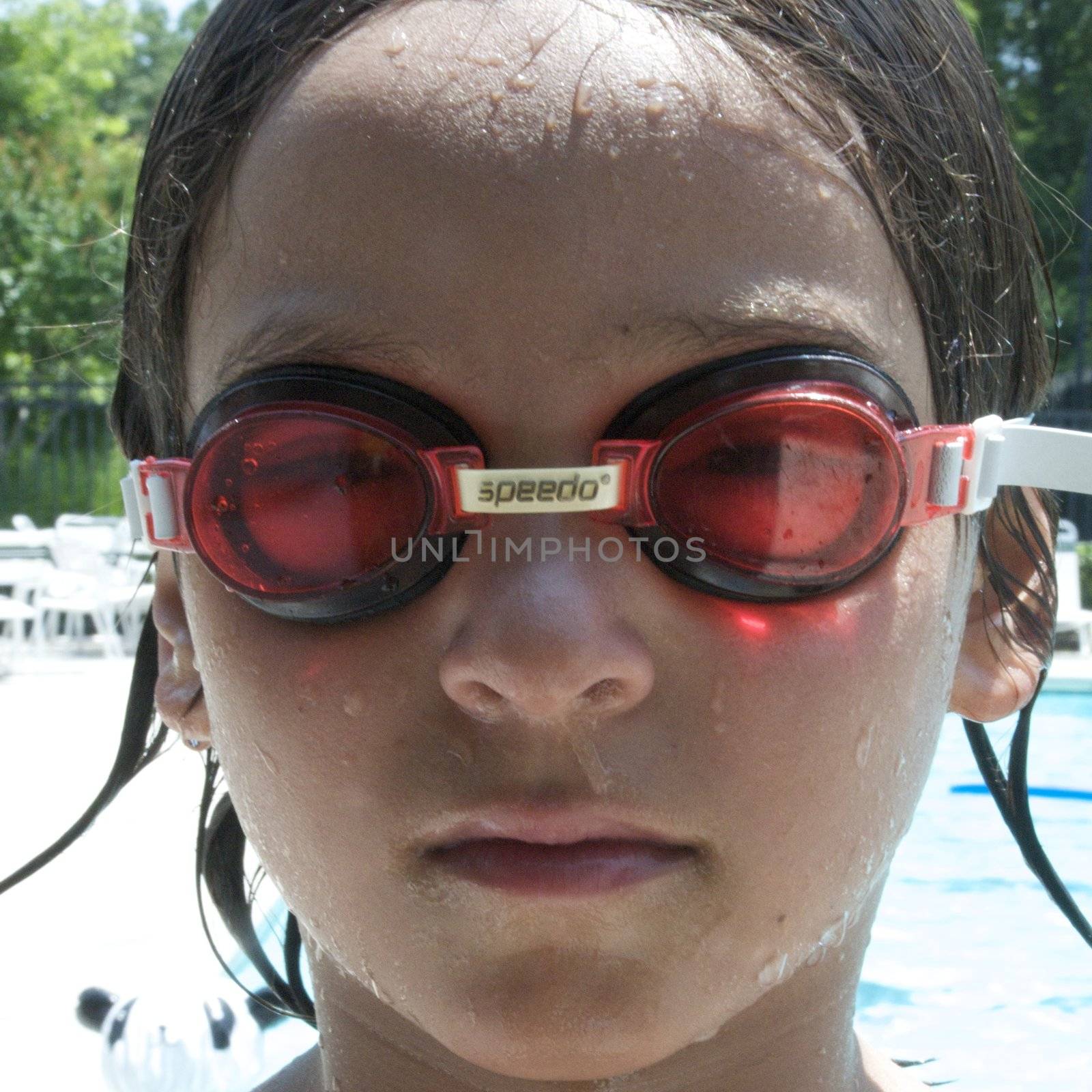 Little boy playing at pool