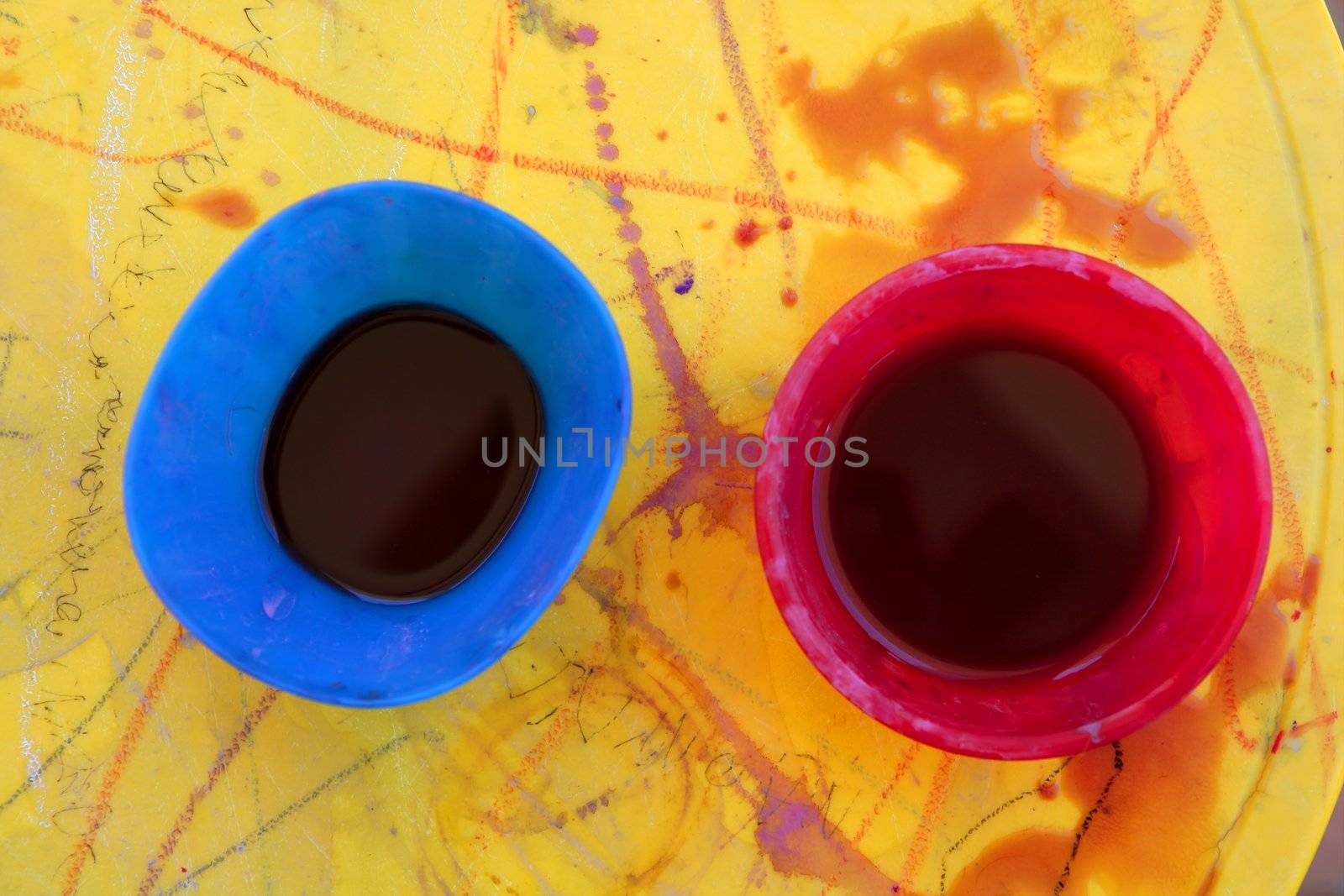 Children messy dirty student watercolor table in vivid colors