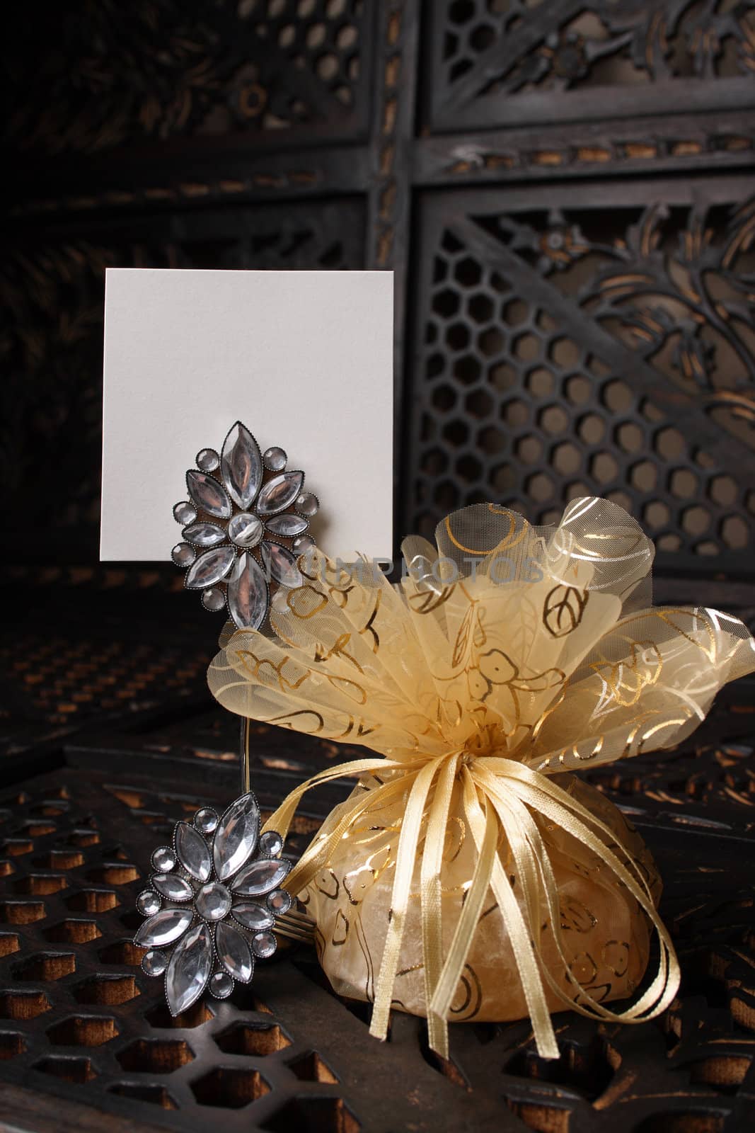 Golden wedding favour with place name holder and blank card
