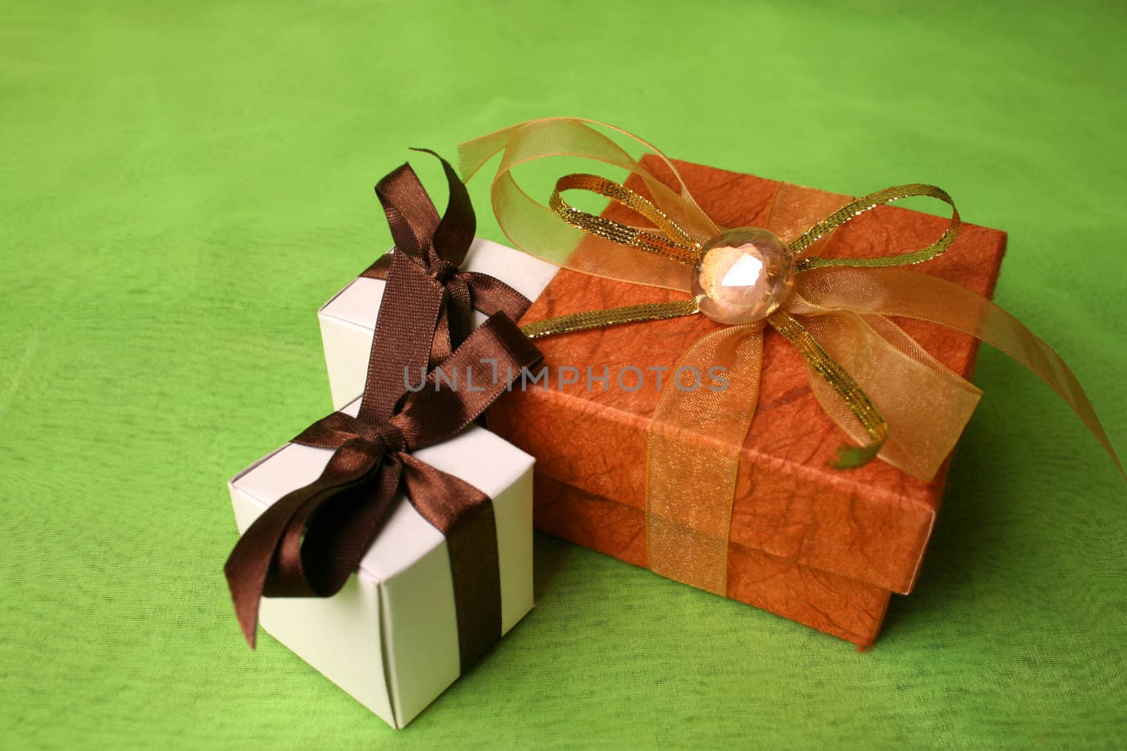 White and Copper gift boxes with ribbons and pebble