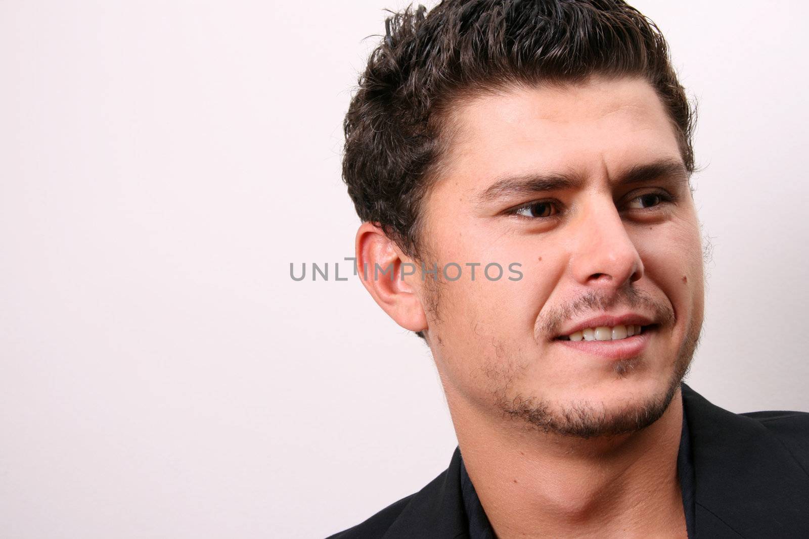 Male model in studio against white wall