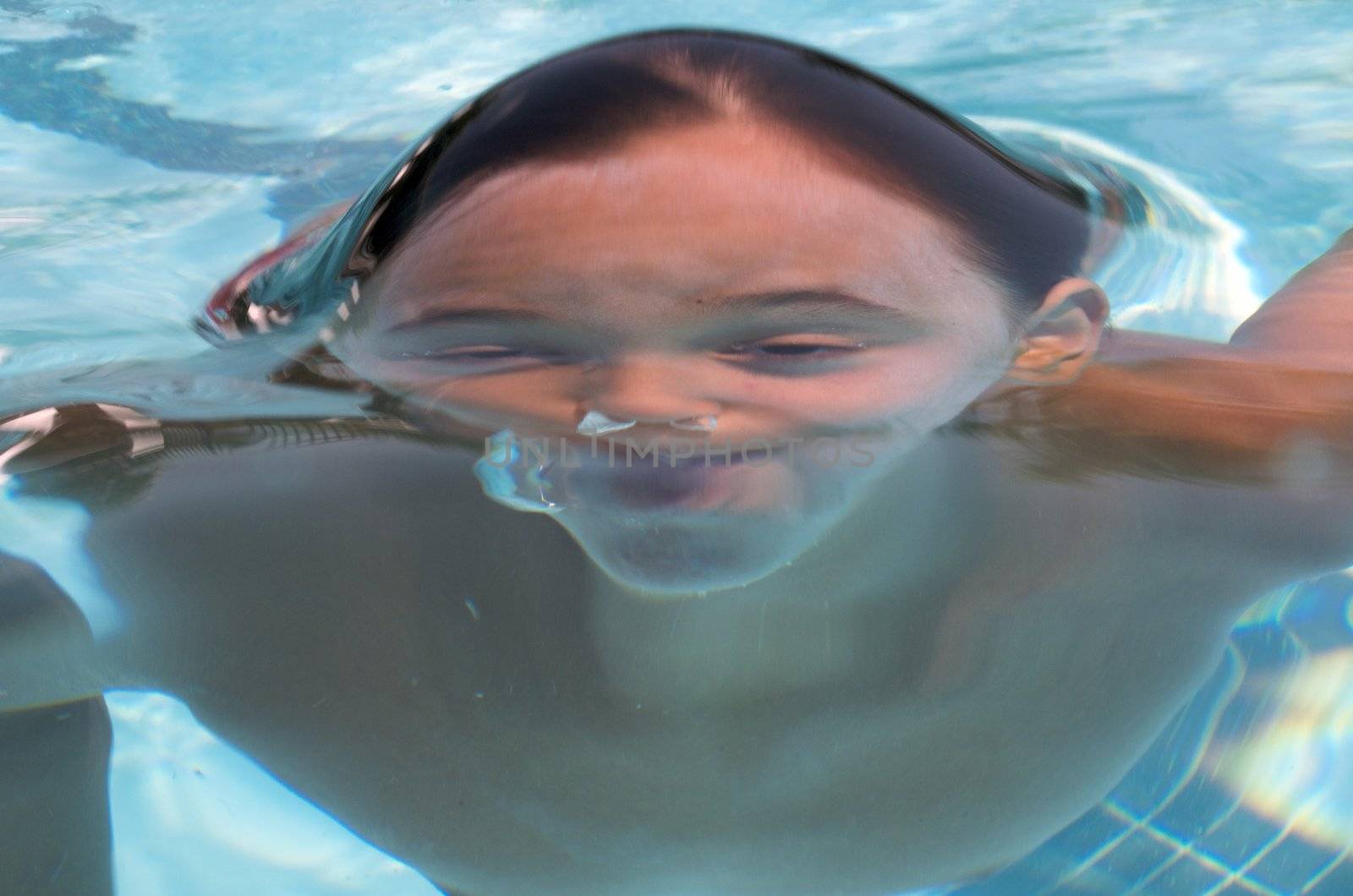 Little boy learning to swim