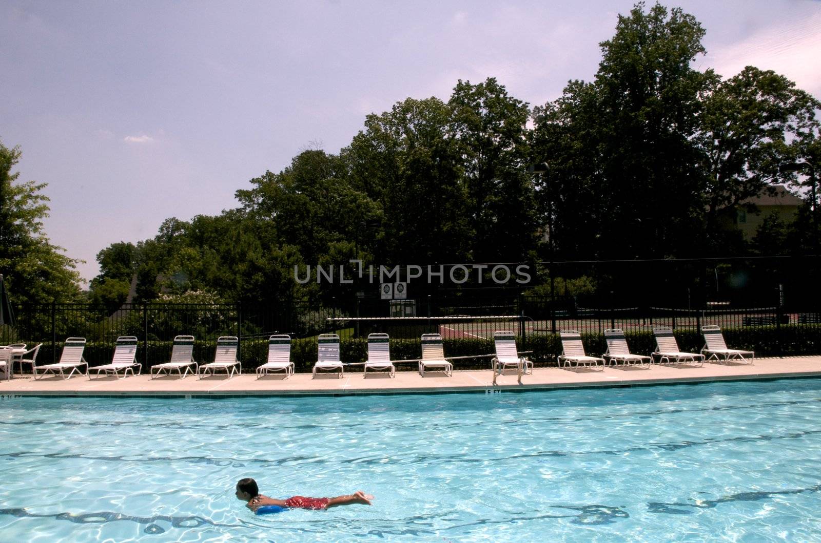 Little boy learning to swim